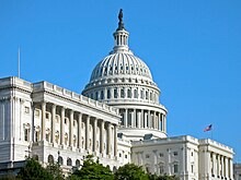 U.S. Capitol building in Washington, D.C., with clear blue sky in the background.