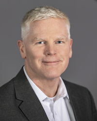 Todd Anderson, Vice President and Chief Technology Officer at PHINIA, wearing a dark blazer and white shirt, professional headshot.